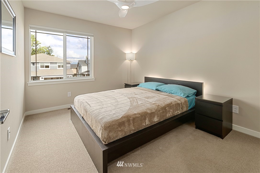 17512 Meridian Place West Bothell, WA 98012 - Photo 20 of 28 a bedroom with a bed and window