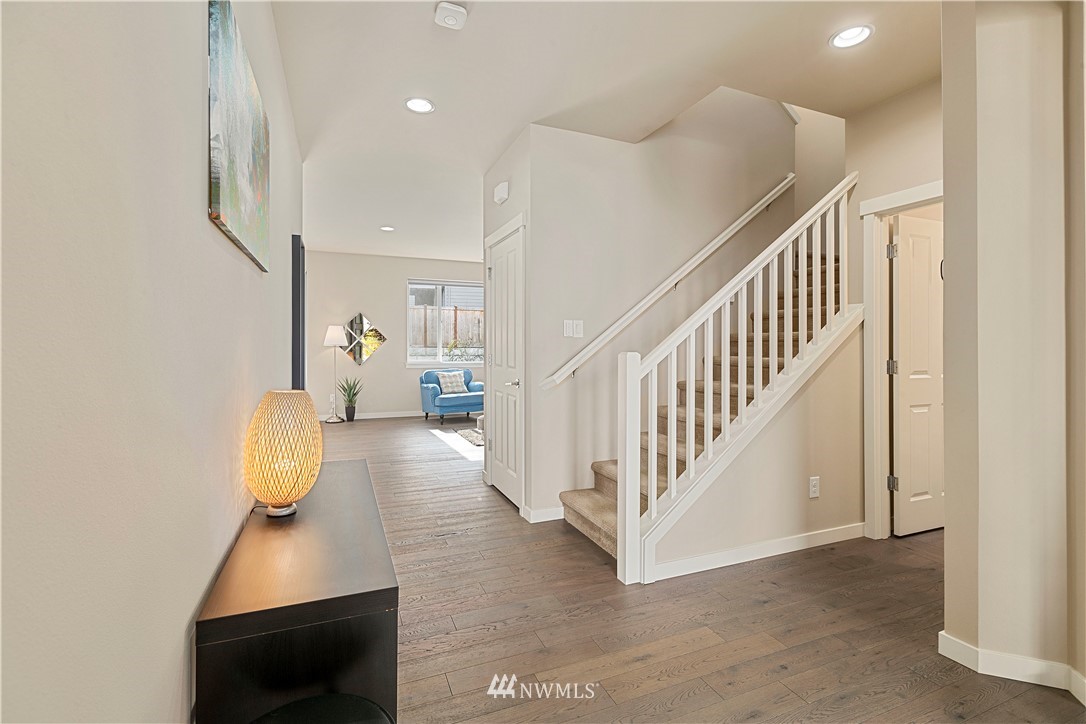 17512 Meridian Place West Bothell, WA 98012 - Photo 3 of 28 a view of entryway and hall with wooden floor