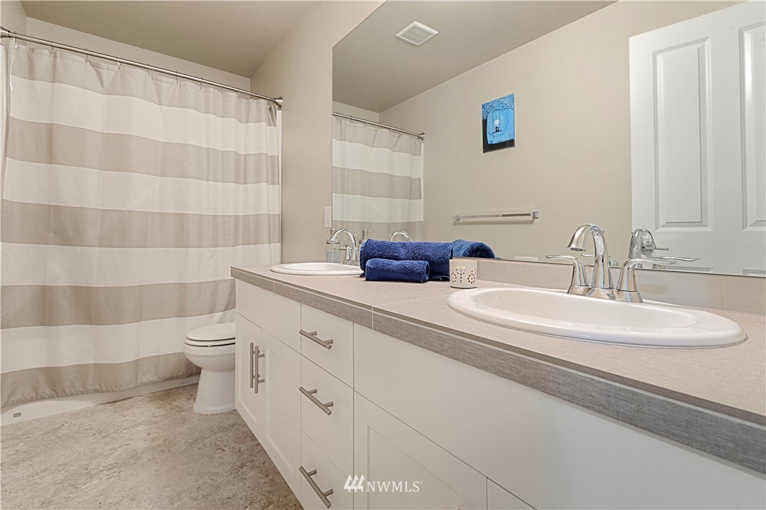 17512 Meridian Place West Bothell, WA 98012 - Photo 21 of 28 a bathroom with a double vanity sink toilet and shower