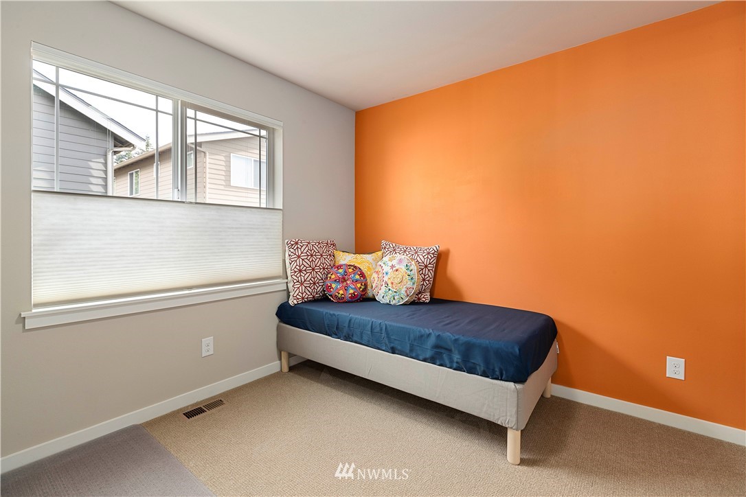 17512 Meridian Place West Bothell, WA 98012 - Photo 22 of 28 a room with a bed and a window
