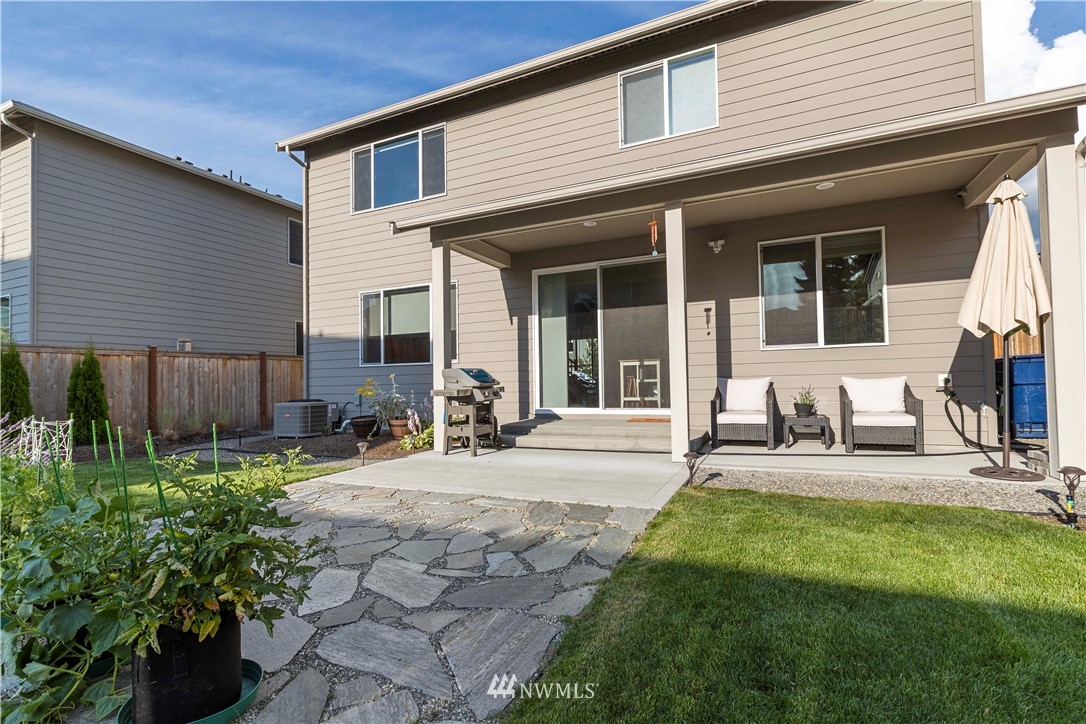 17512 Meridian Place West Bothell, WA 98012 - Photo 26 of 28 a house with garden in front of it