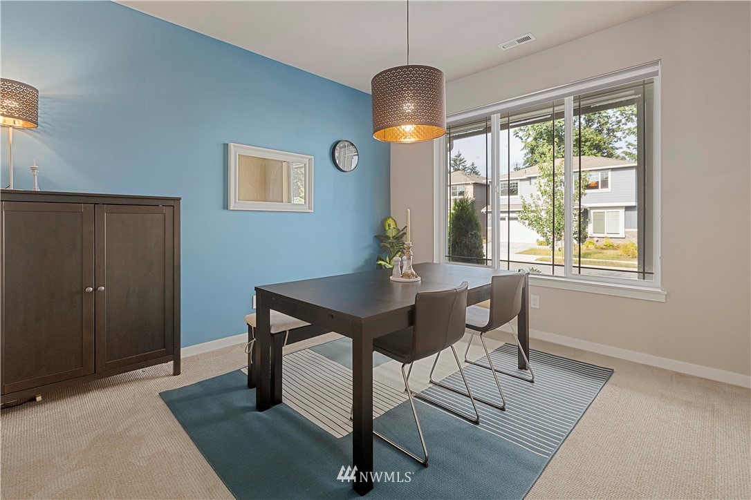 17512 Meridian Place West Bothell, WA 98012 - Photo 9 of 28 a view of a dining room with furniture window and outside view
