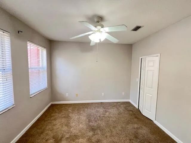 a bathroom with a toilet sink and a mirror