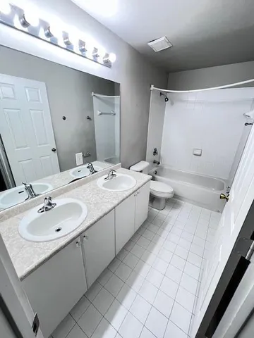 a view of room with window and ceiling fan