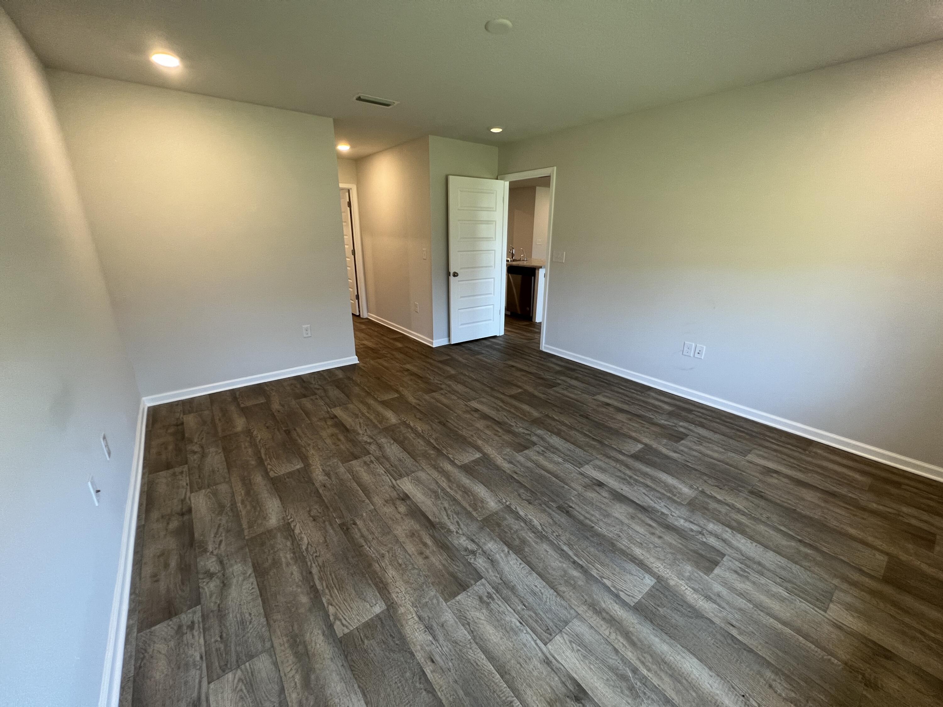 399 This Way Freeport, FL 32439 - Photo 13 of 29 a view of an empty room and wooden floor