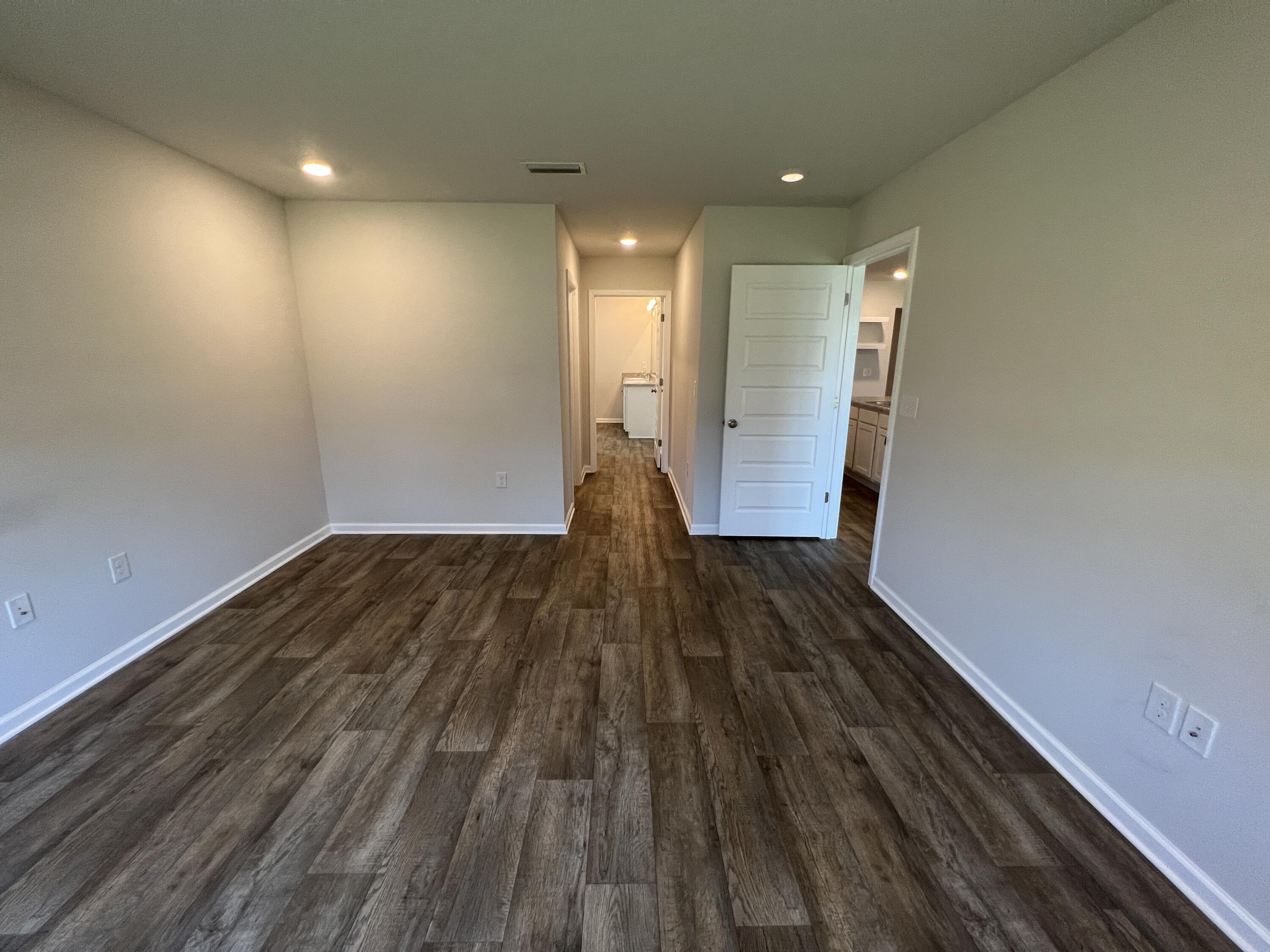 399 This Way Freeport, FL 32439 - Photo 14 of 29 a view of entryway with wooden floor