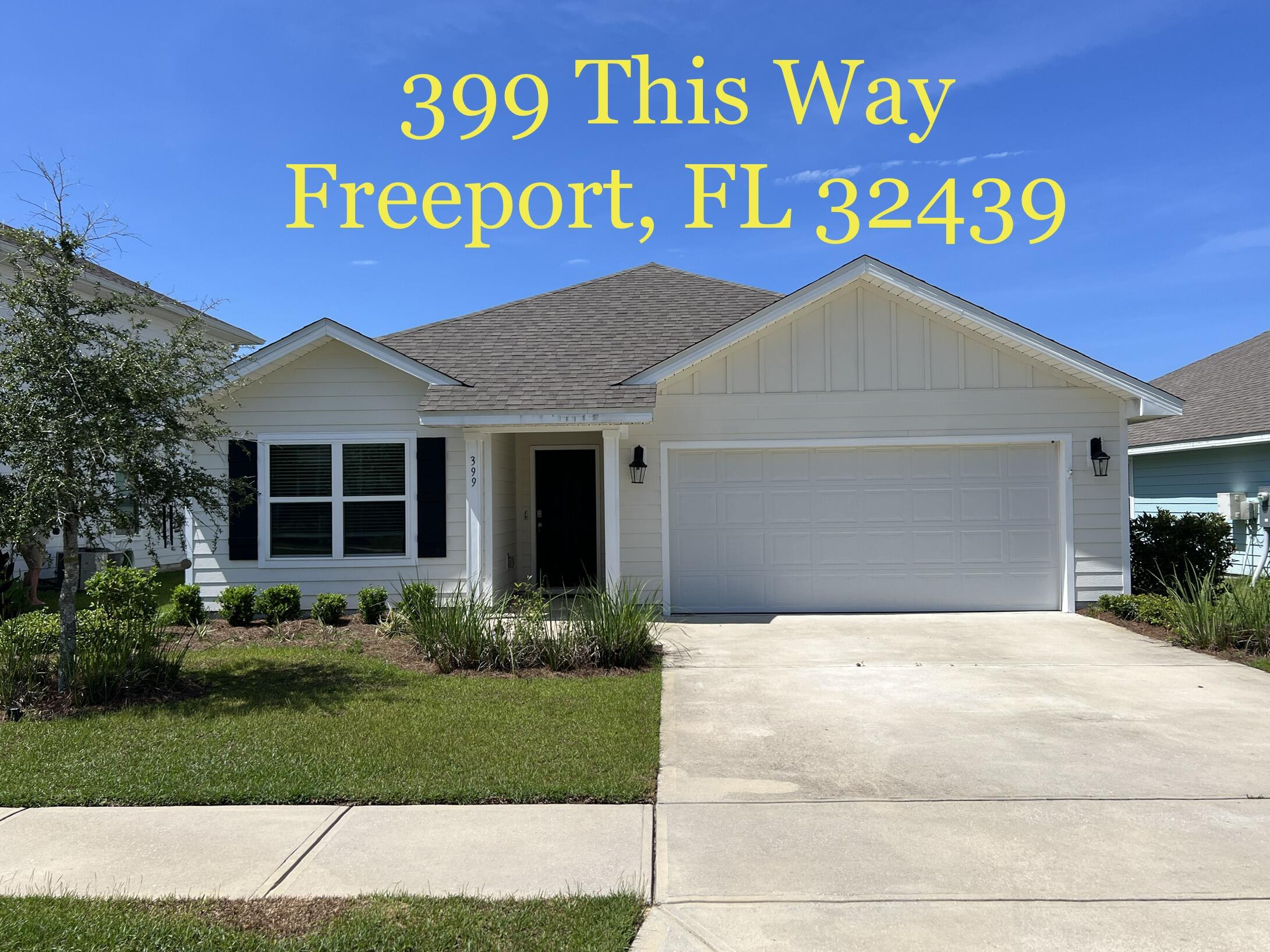 399 This Way Freeport, FL 32439 - Photo 29 of 29 a front view of a house with a yard