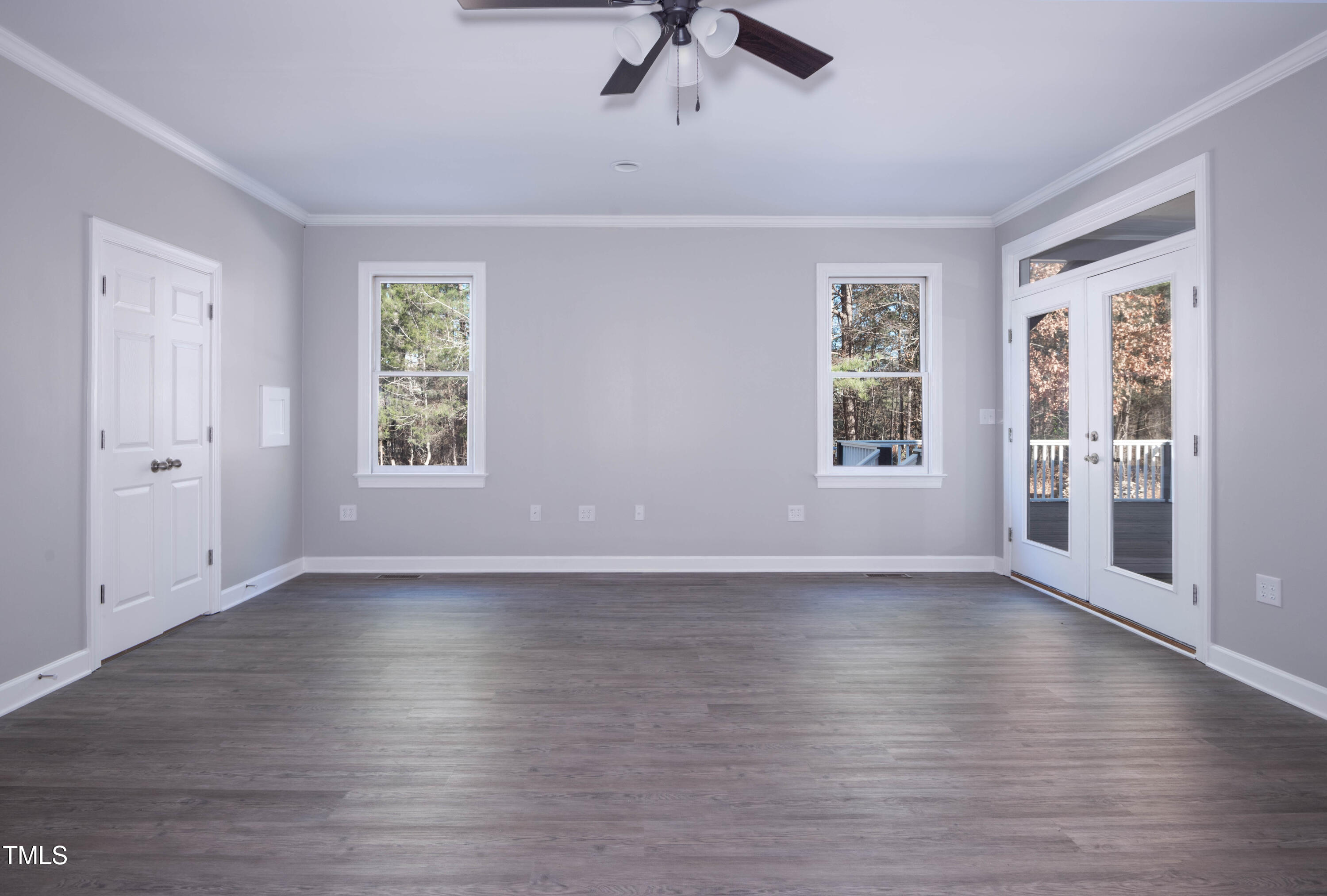 4222 Rogers Road Durham, NC 27703 - Photo 25 of 84 an empty room with wooden floor and windows
