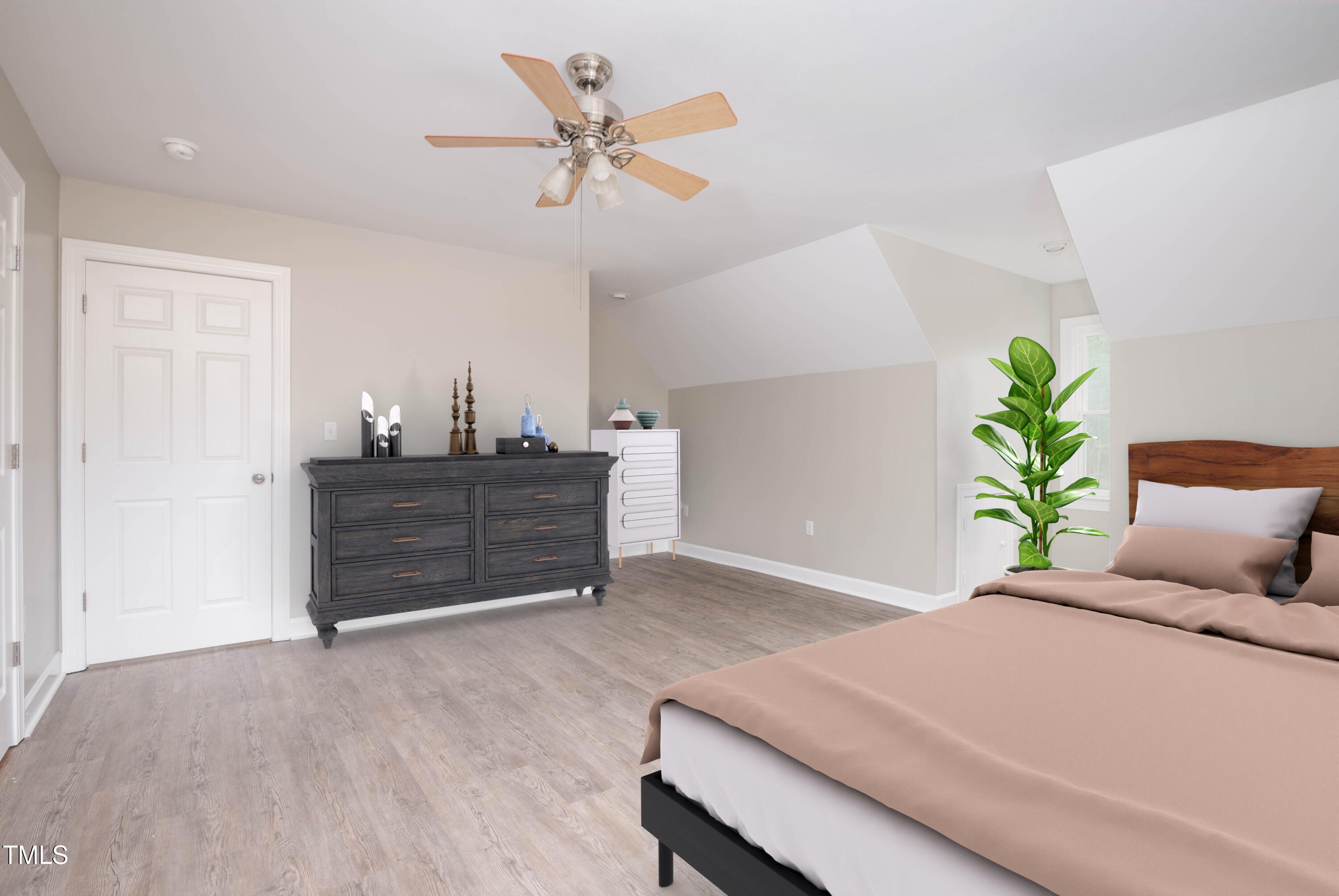 4222 Rogers Road Durham, NC 27703 - Photo 59 of 84 a bed room with a bed and a potted plant