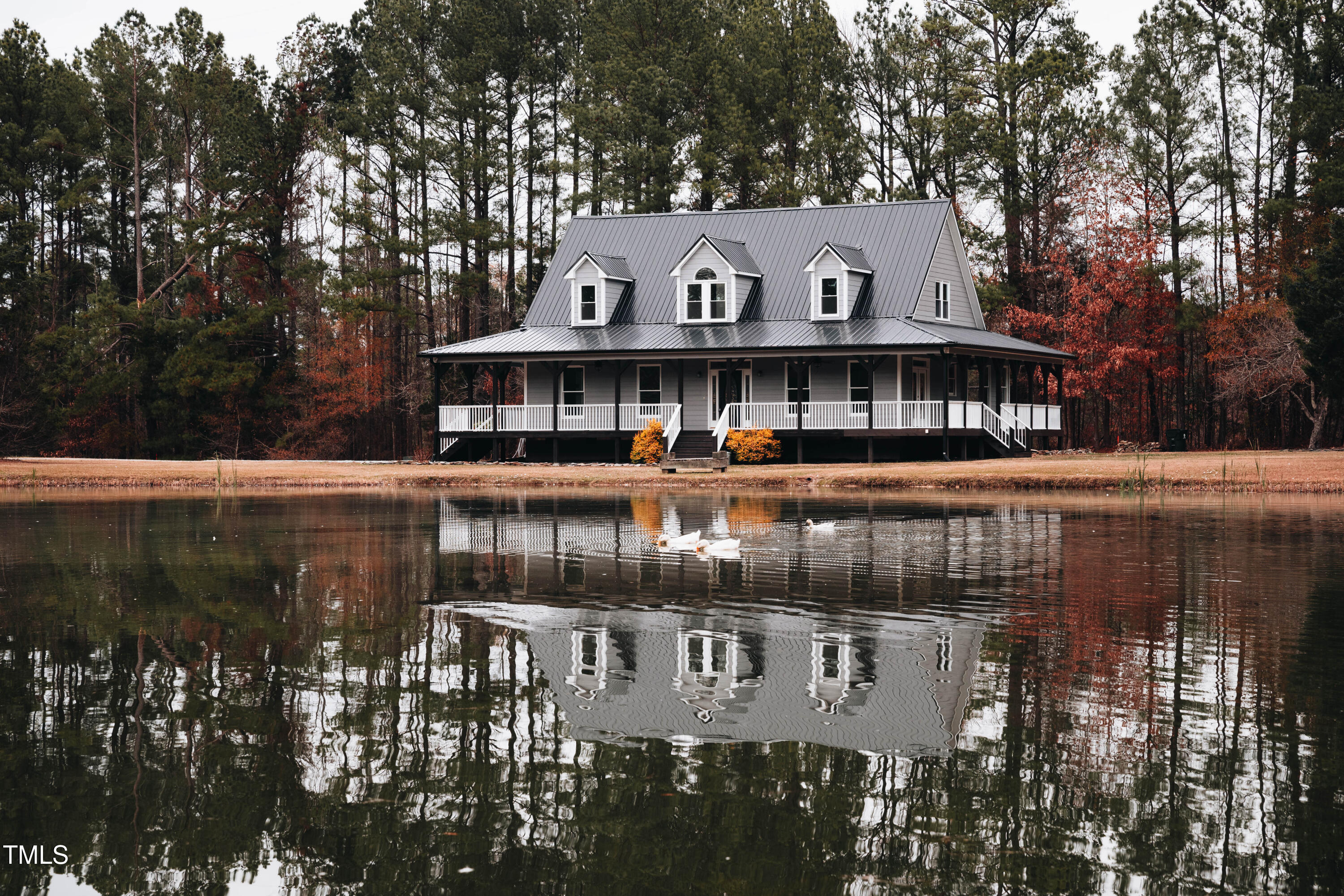 4222 Rogers Road Durham, NC 27703 - Photo 69 of 84 a front view of a building with river and trees