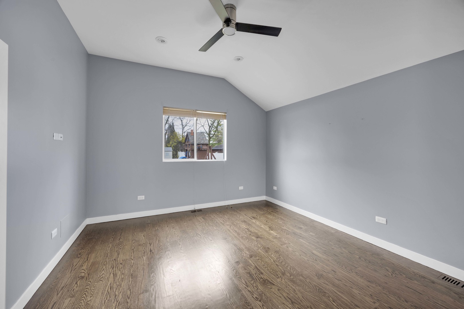 9059 Oneill Drive Burr Ridge, IL 60527 - Photo 12 of 15 an empty room with wooden floor and windows