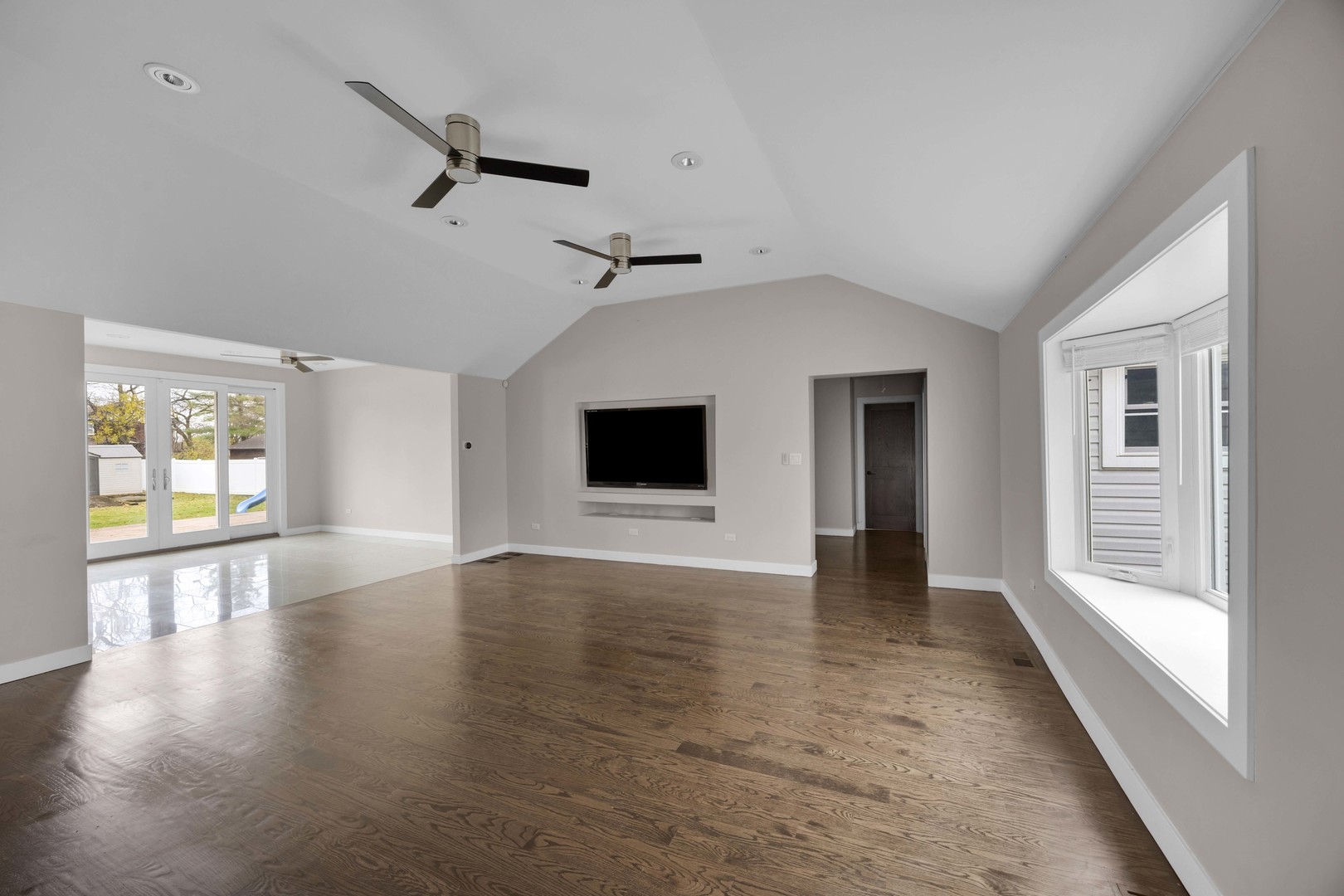 9059 Oneill Drive Burr Ridge, IL 60527 - Photo 5 of 15 wooden floor in an empty room with a window