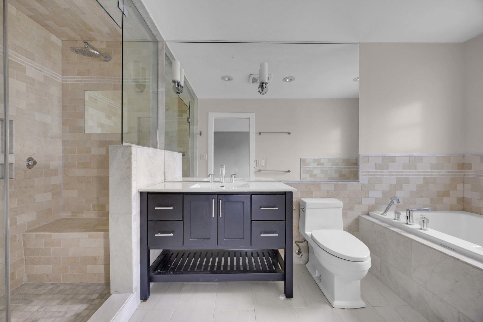 9059 Oneill Drive Burr Ridge, IL 60527 - Photo 8 of 15 a bathroom with a sink a toilet and shower