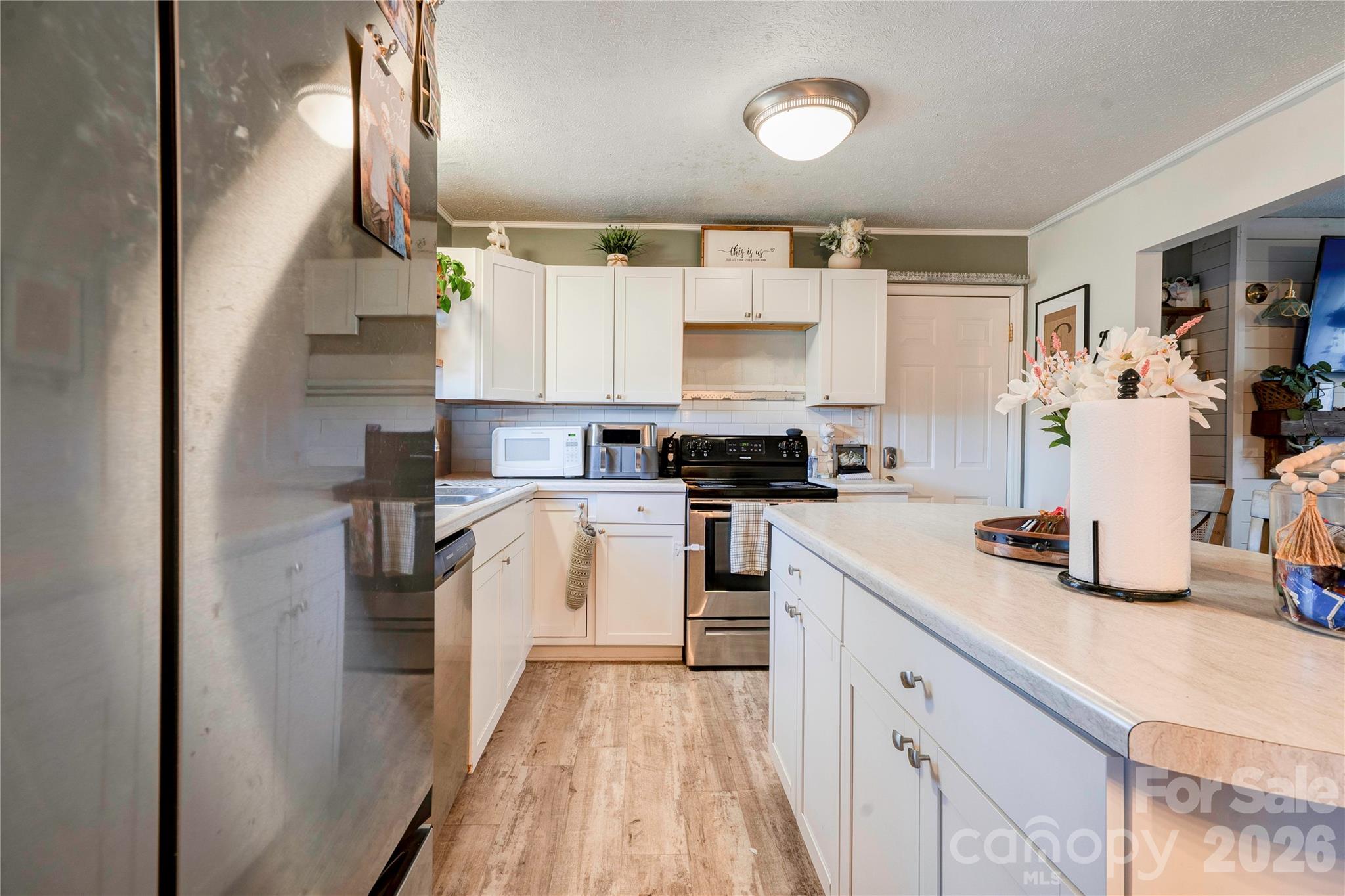 2106 South Post Road Shelby, NC 28152 - Photo 14 of 26 a kitchen with white cabinets and appliances