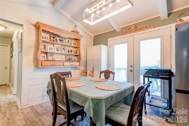 a view of a dining room with furniture and window