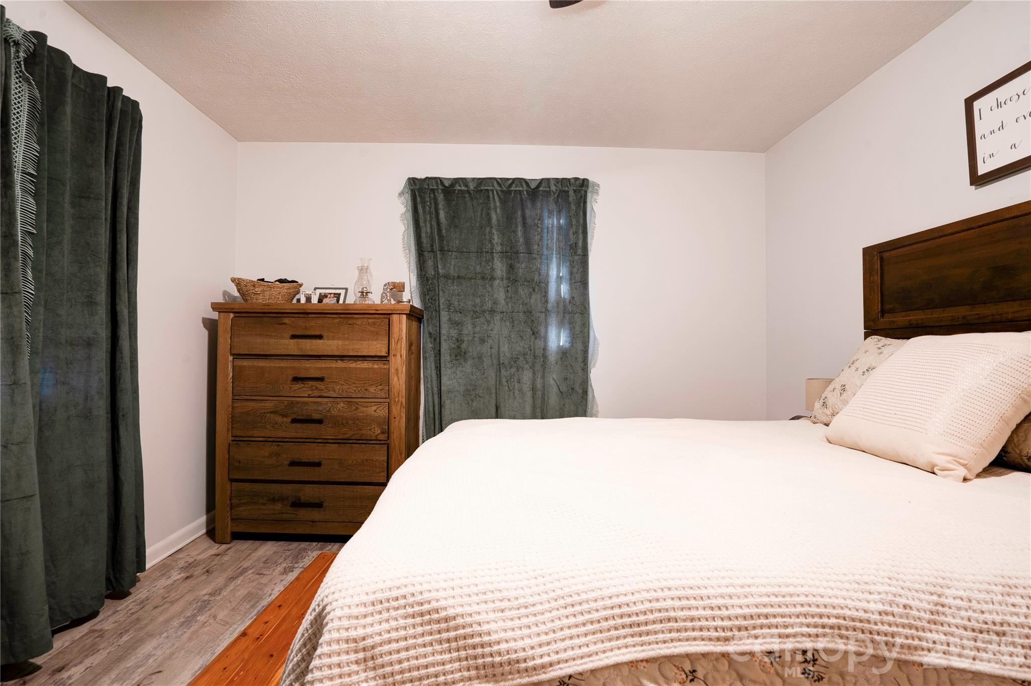 2106 South Post Road Shelby, NC 28152 - Photo 22 of 26 a bedroom with a bed and a television