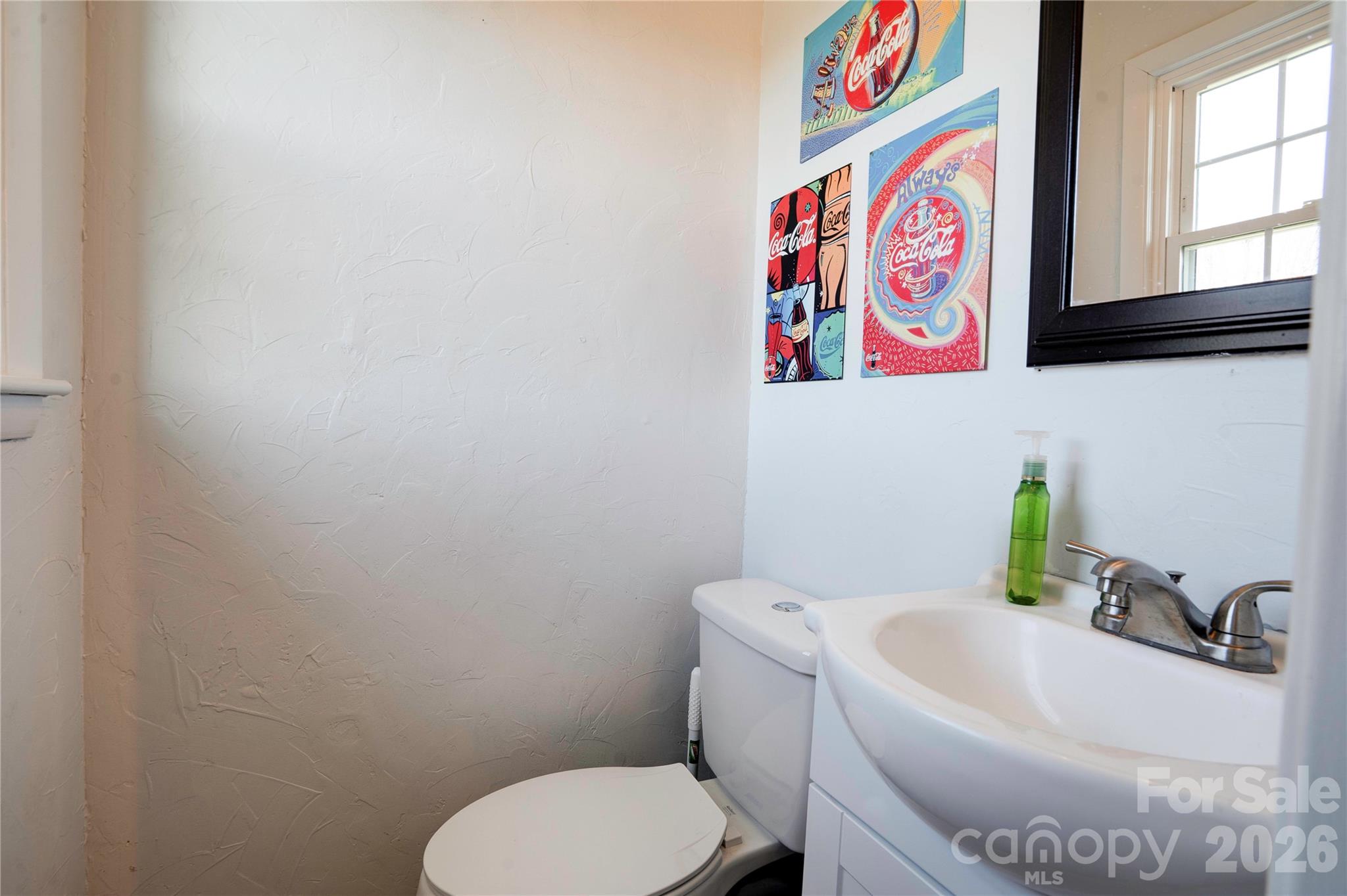 2106 South Post Road Shelby, NC 28152 - Photo 23 of 26 a white toilet sitting next to a bathroom sink