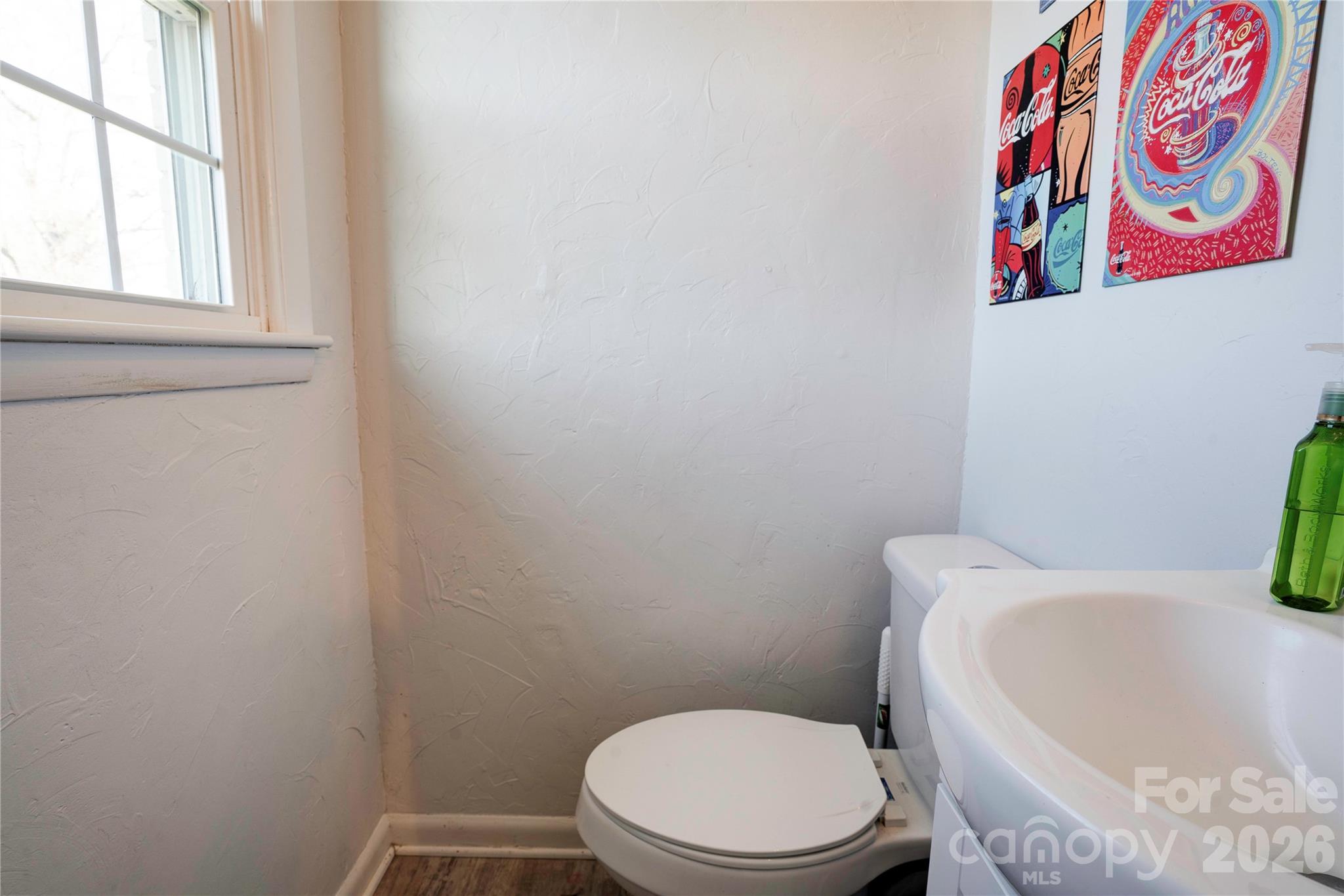 2106 South Post Road Shelby, NC 28152 - Photo 24 of 26 a white toilet sitting next to a window