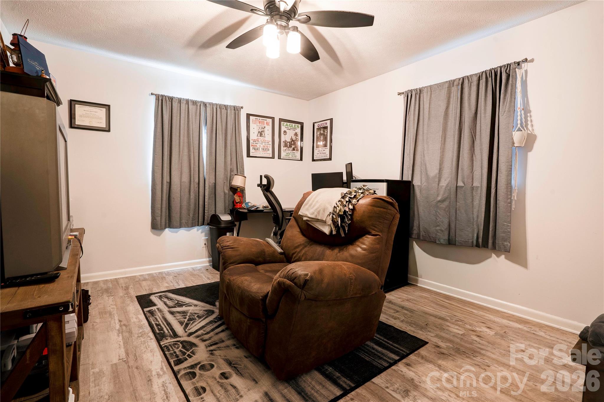 2106 South Post Road Shelby, NC 28152 - Photo 25 of 26 a living room with furniture and a flat screen tv