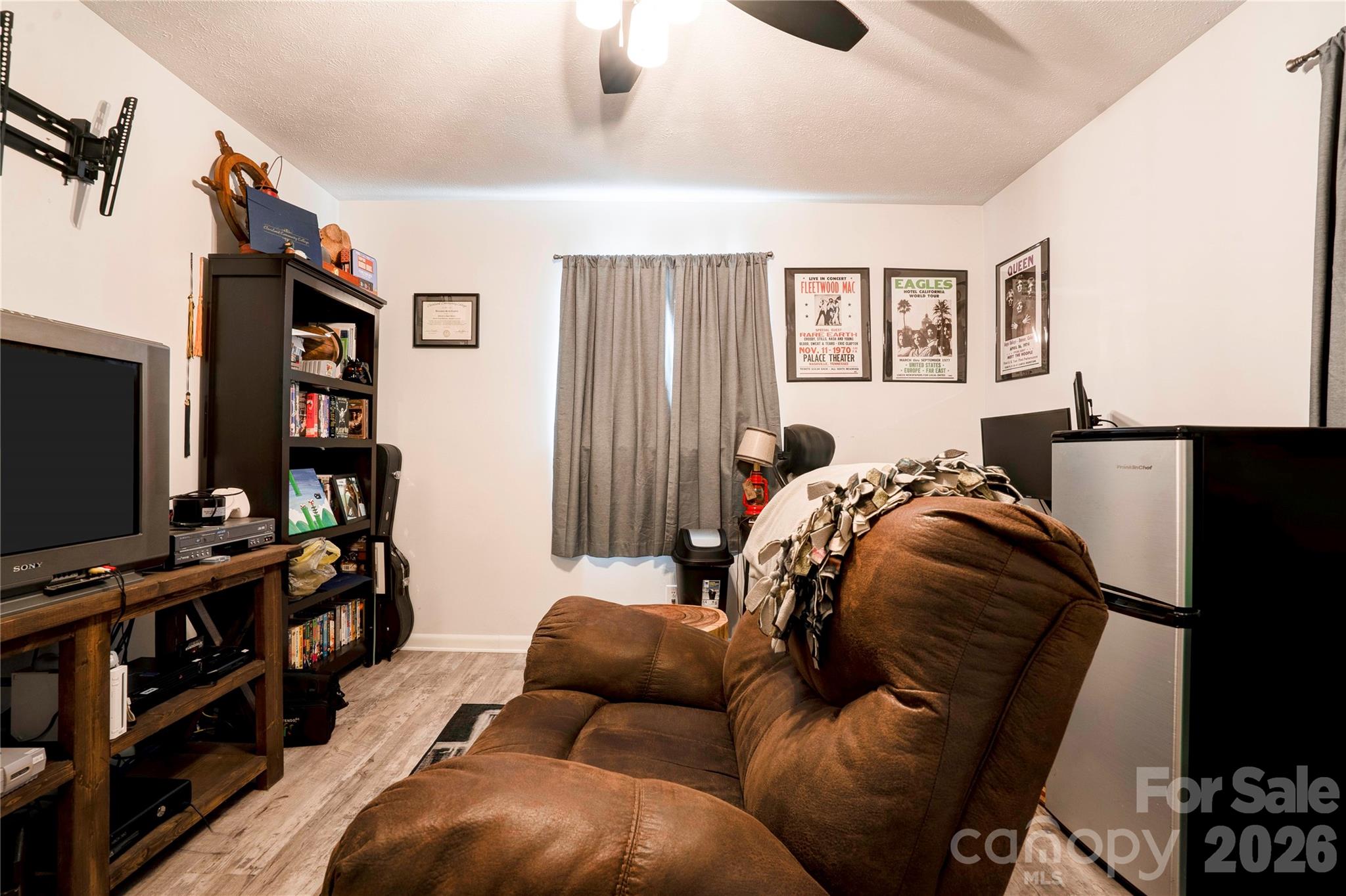 2106 South Post Road Shelby, NC 28152 - Photo 26 of 26 a living room with furniture and a flat screen tv