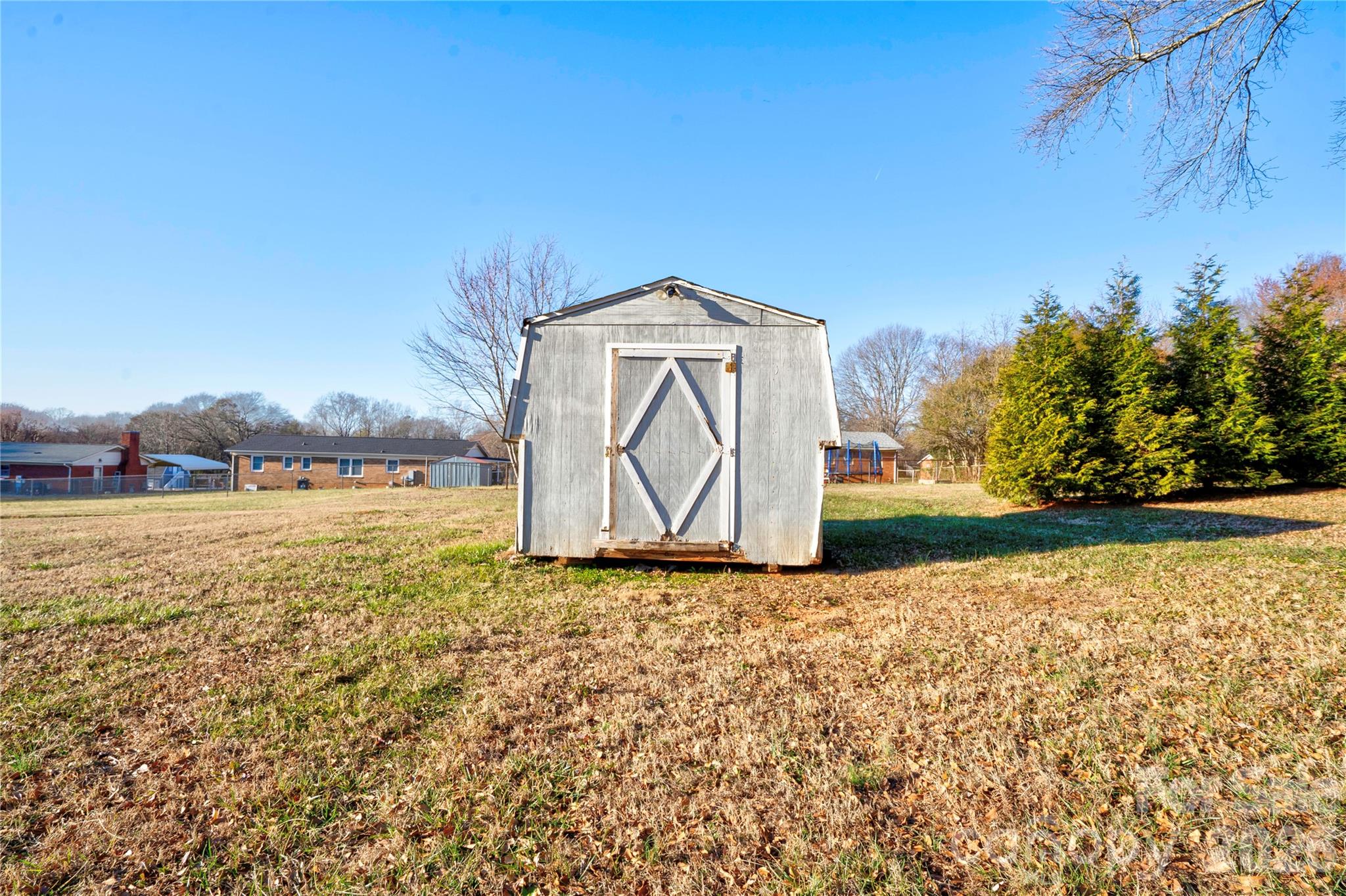 2106 South Post Road Shelby, NC 28152 - Photo 5 of 26 a white building with trees in the background