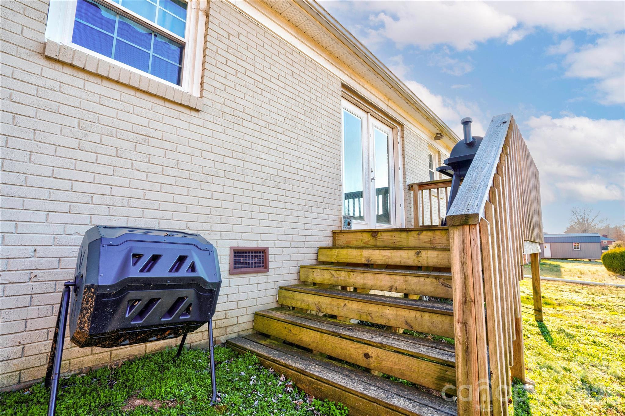 2106 South Post Road Shelby, NC 28152 - Photo 8 of 26 a view of a bench in front of house