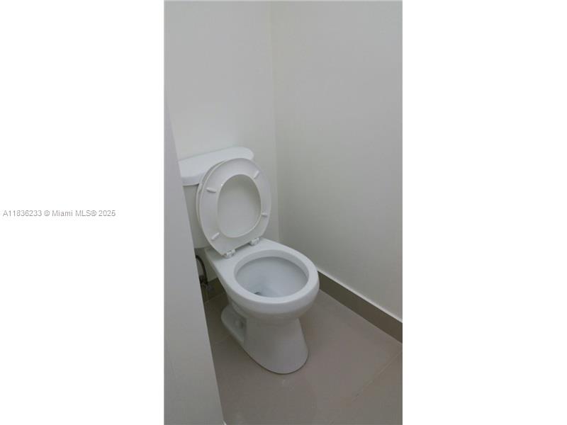 8015 Southwest 107th Avenue, Unit 209 Miami, FL 33173 - Photo 14 of 43 a white toilet sitting next to a white sink