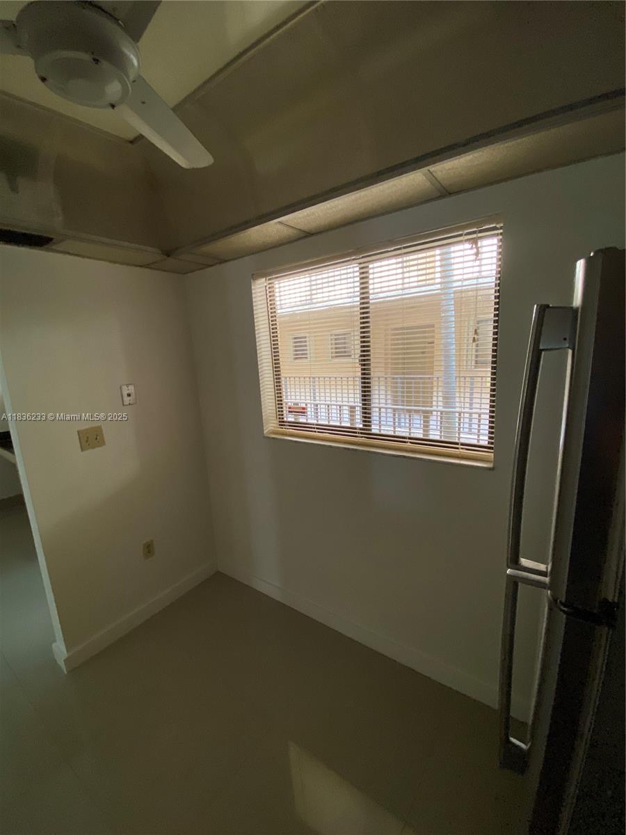 8015 Southwest 107th Avenue, Unit 209 Miami, FL 33173 - Photo 19 of 43 a view of empty room with windows