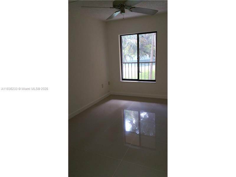 8015 Southwest 107th Avenue, Unit 209 Miami, FL 33173 - Photo 29 of 43 a view of a living room with a window