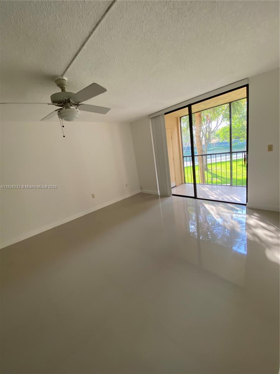 8015 Southwest 107th Avenue, Unit 209 Miami, FL 33173 - Photo 3 of 43 an empty room with a window