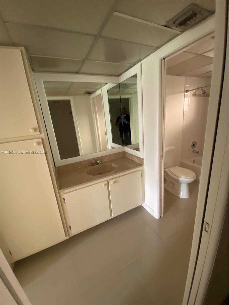 8015 Southwest 107th Avenue, Unit 209 Miami, FL 33173 - Photo 5 of 43 a view of washer and dryer