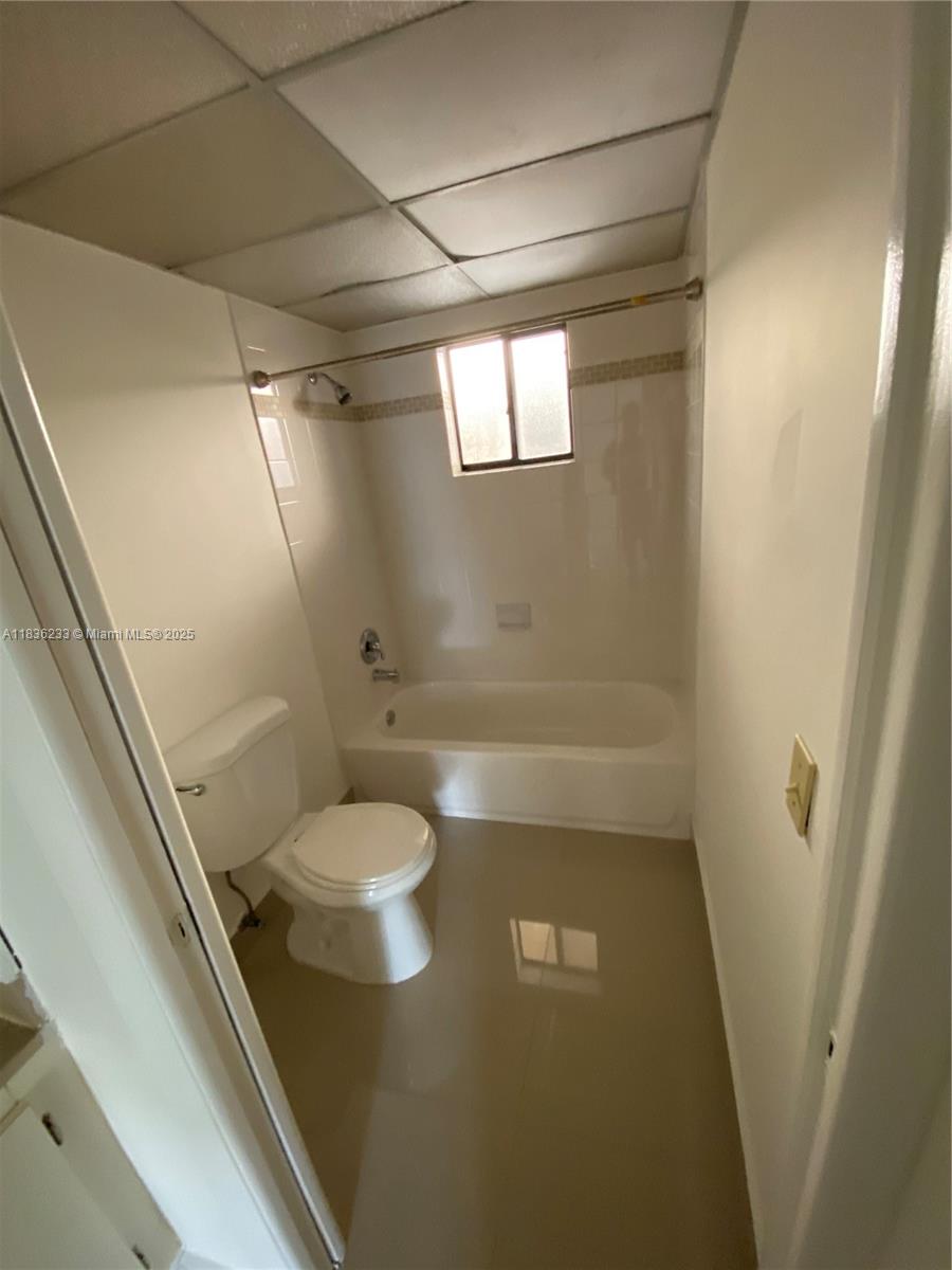 8015 Southwest 107th Avenue, Unit 209 Miami, FL 33173 - Photo 6 of 43 a bathroom with a toilet and a shower