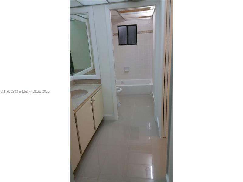 8015 Southwest 107th Avenue, Unit 209 Miami, FL 33173 - Photo 8 of 43 a en suite bathroom with a sink