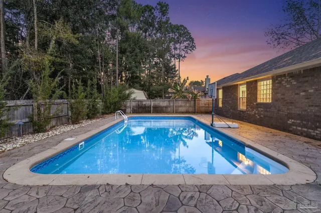 a view of a backyard both side of a house