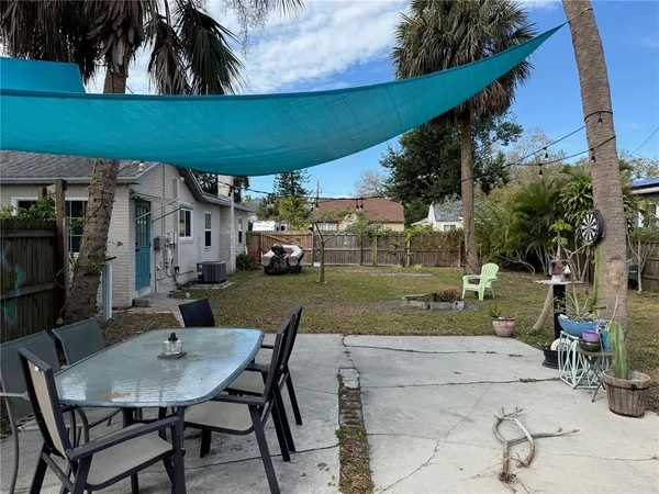 a view of yard with patio