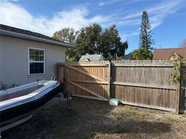 a view of backyard with deck and backyard