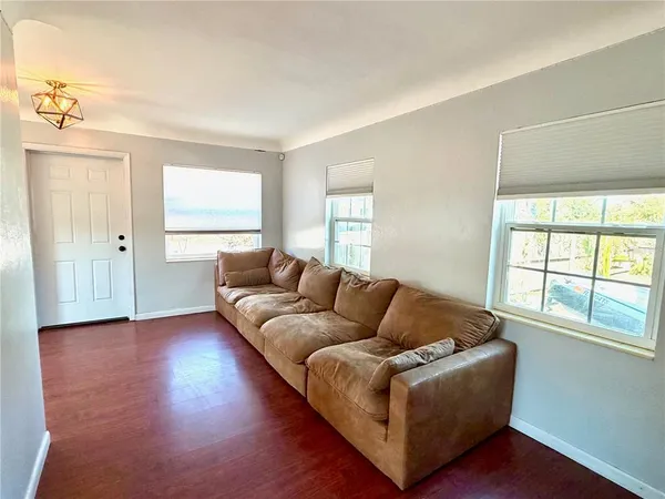a living room with furniture and a window