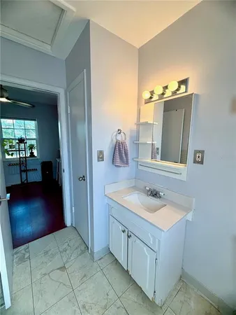 a bathroom with a sink and a mirror