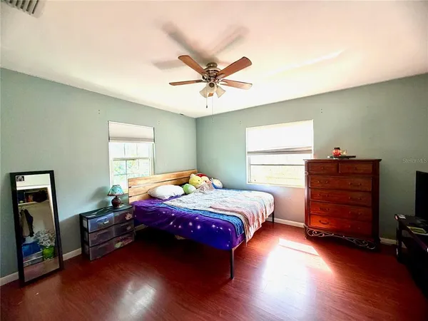 a bedroom with a bed and a closet