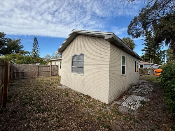 a backyard of a house with lots of green space