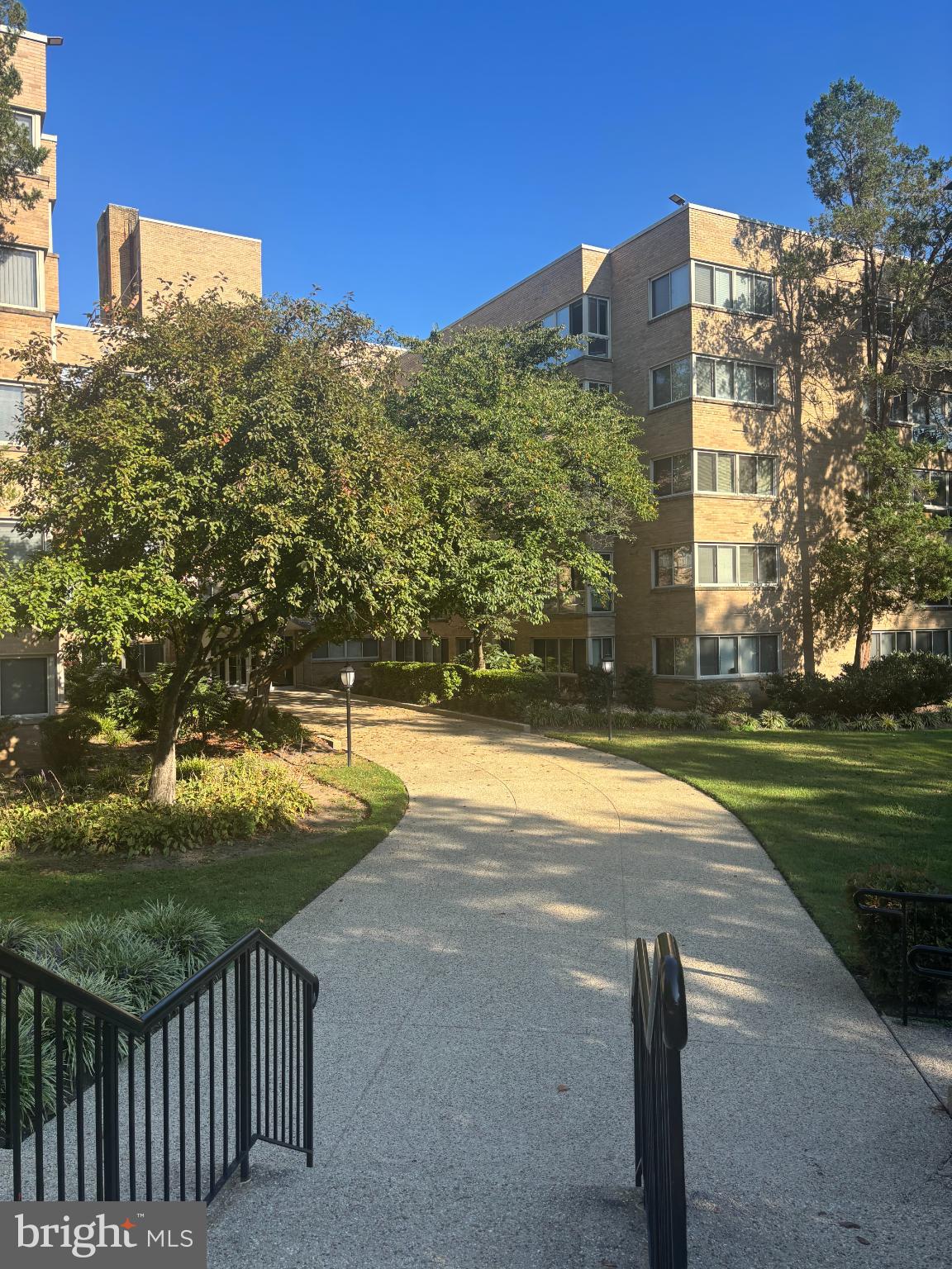 6445 Luzon Avenue Northwest, Unit 501 Washington, DC 20012 - Photo 15 of 21 a view of a large building with a yard
