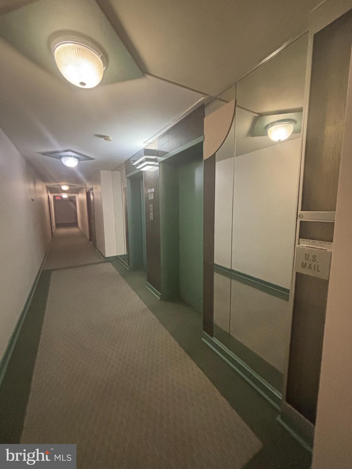 6445 Luzon Avenue Northwest, Unit 501 Washington, DC 20012 - Photo 16 of 21 a view of a hallway with wooden floor
