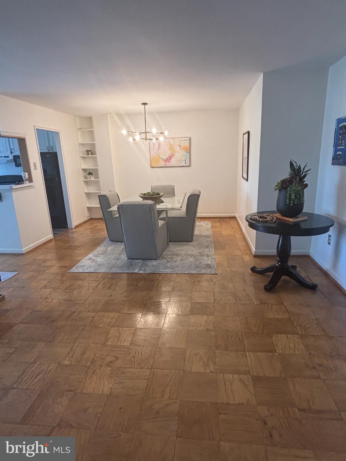 6445 Luzon Avenue Northwest, Unit 501 Washington, DC 20012 - Photo 5 of 21 a living room with furniture and a dining table