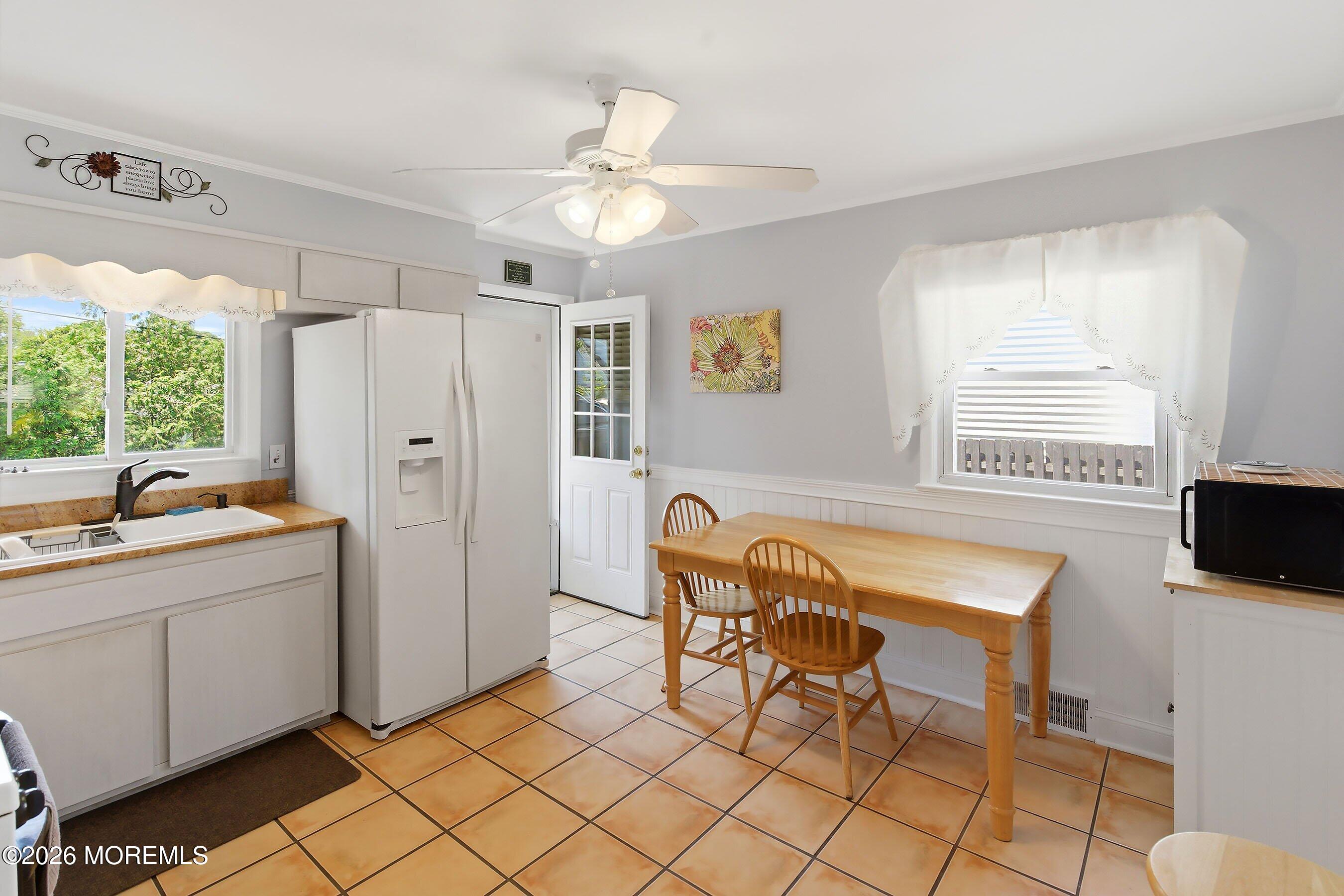 412 Moore Road Neptune Township, NJ 07753 - Photo 8 of 36 a dining room with furniture and window