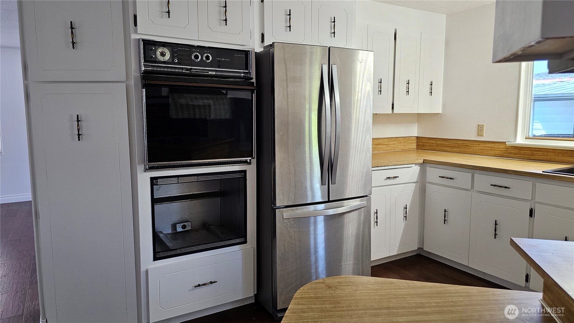 1402 22nd Street Northeast, Unit 252 Auburn, WA 98002 - Photo 11 of 36 a kitchen with stainless steel appliances a refrigerator sink and cabinets