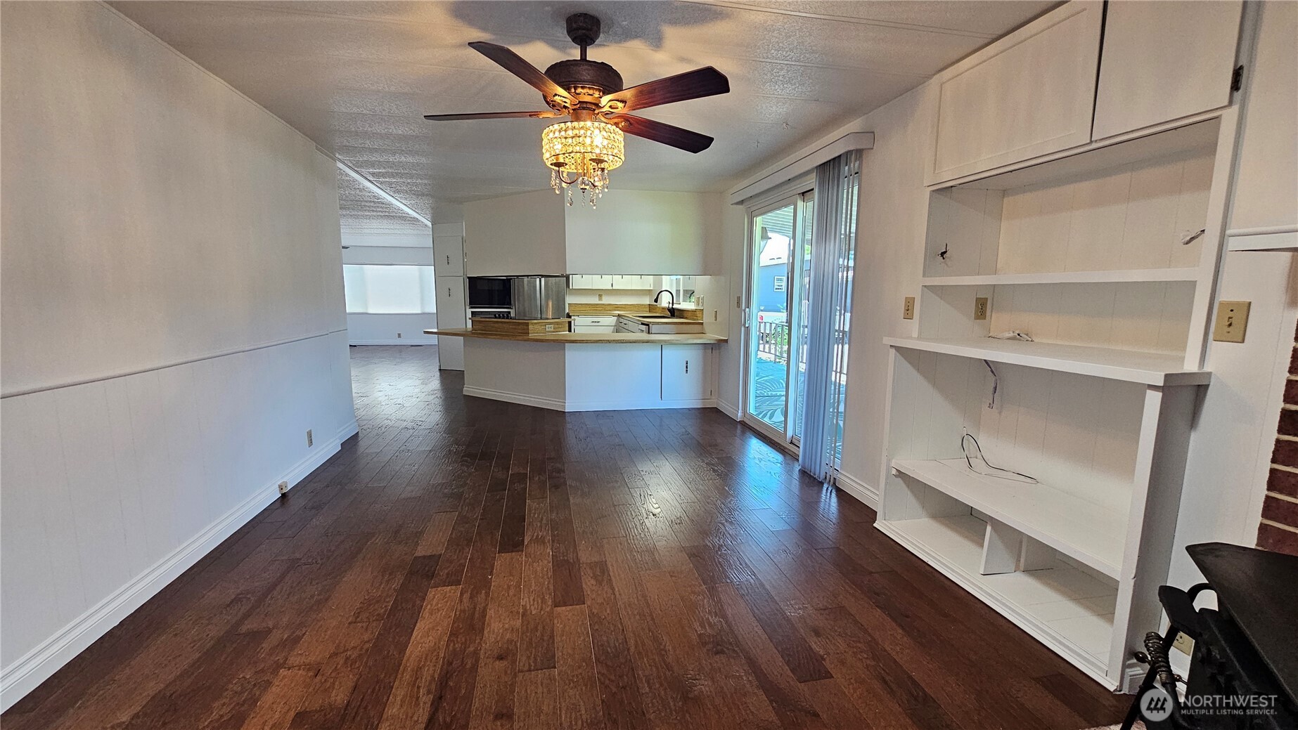 1402 22nd Street Northeast, Unit 252 Auburn, WA 98002 - Photo 13 of 36 a view of a kitchen with wooden floor and a window