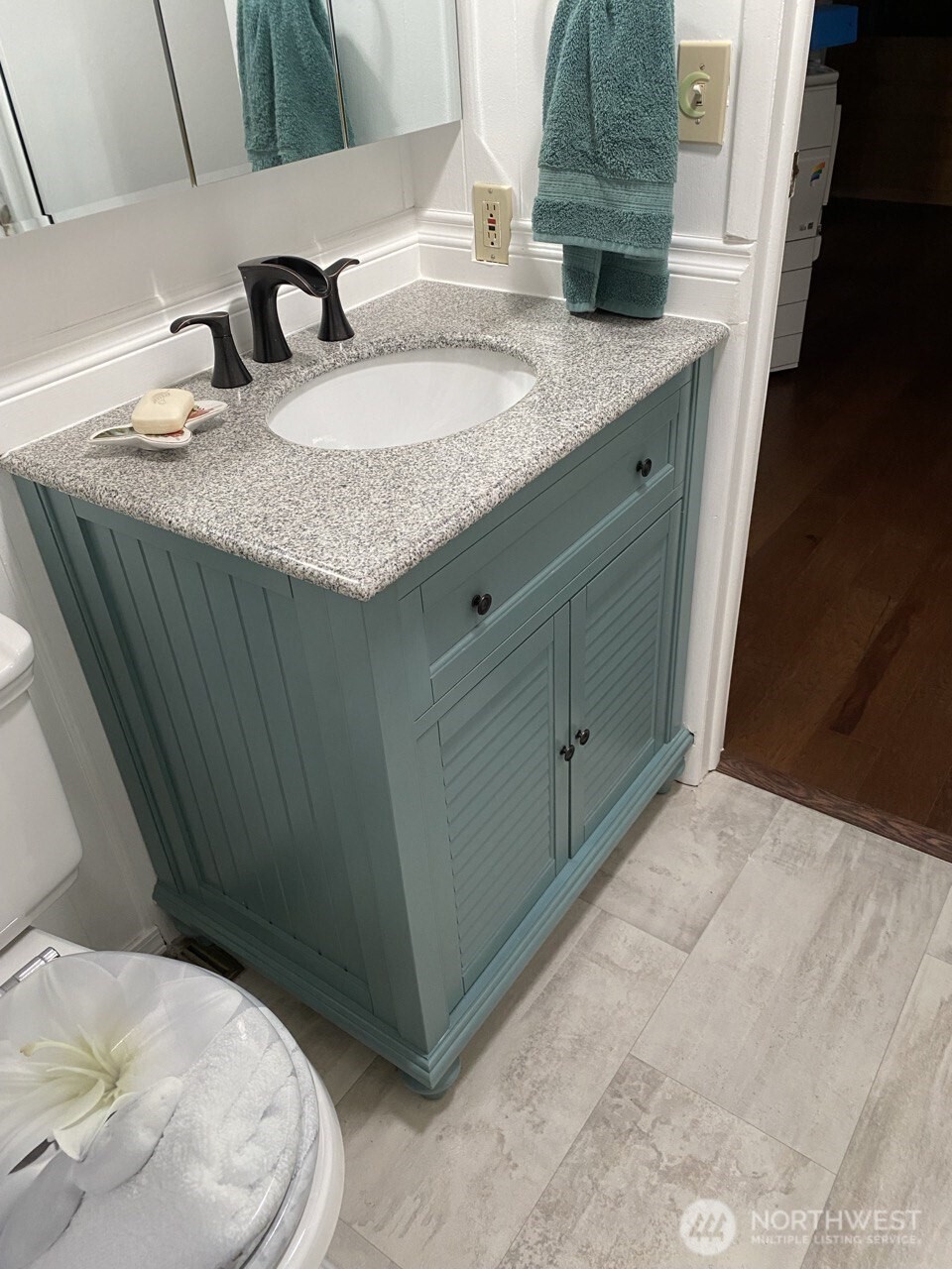 1402 22nd Street Northeast, Unit 252 Auburn, WA 98002 - Photo 20 of 36 a bathroom with a sink and vanity