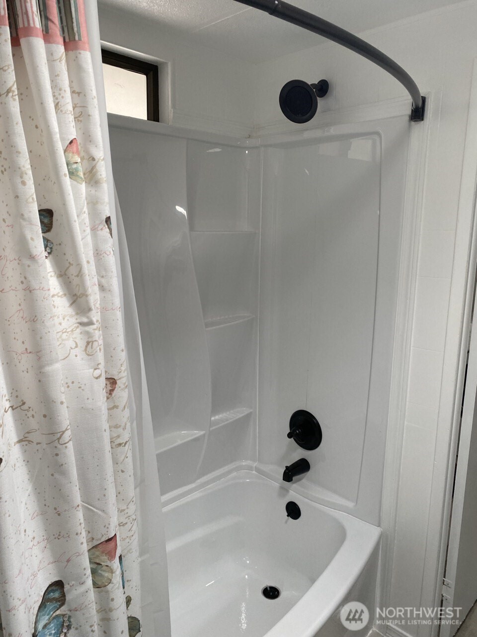 1402 22nd Street Northeast, Unit 252 Auburn, WA 98002 - Photo 21 of 36 a bathroom with a tub and shower