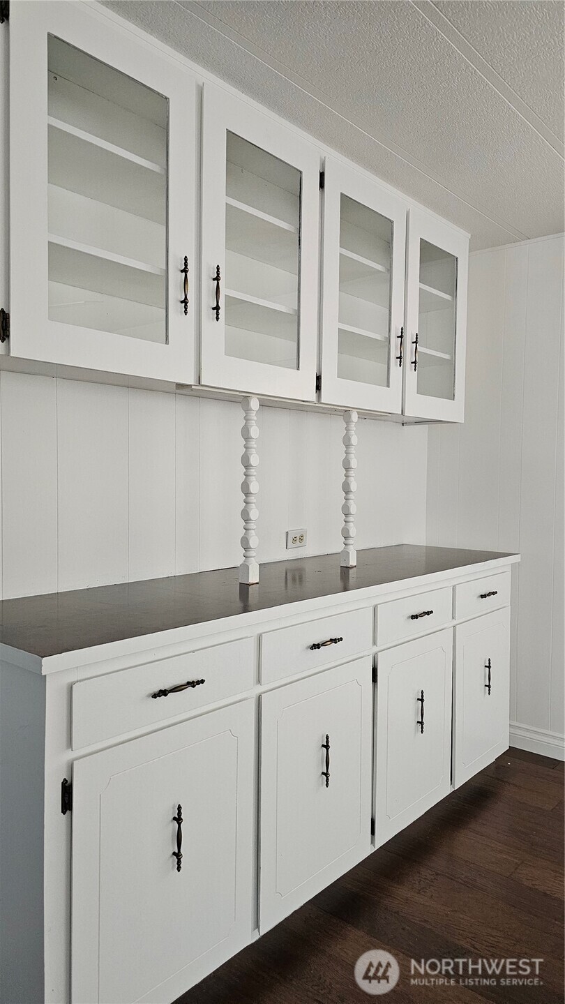 1402 22nd Street Northeast, Unit 252 Auburn, WA 98002 - Photo 22 of 36 a kitchen with white cabinets and white appliances