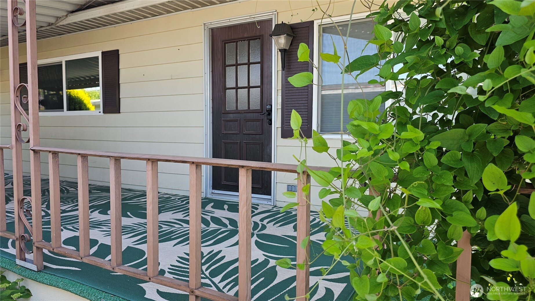 1402 22nd Street Northeast, Unit 252 Auburn, WA 98002 - Photo 3 of 36 a backyard of a house with seating space and potted plants